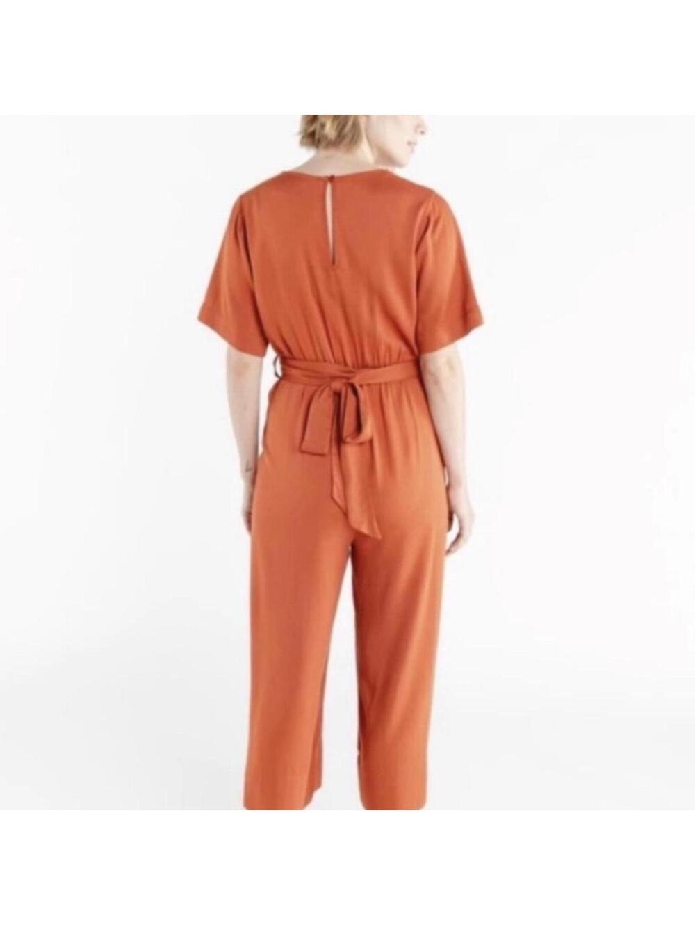 Ban.do surplice orange jumpsuit with tie waist and pockets. Size: S